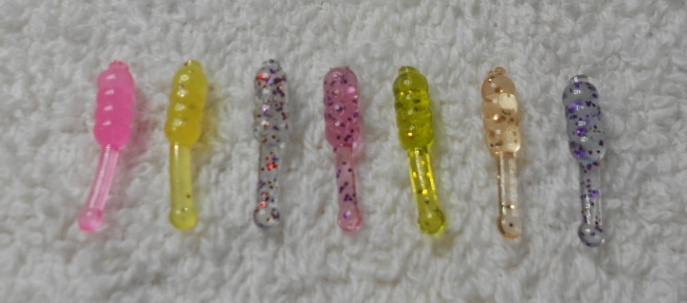 From left to right: Hot Fluorescent Pink, Honey Glitter (discontinued), Candy Fleck, Strawberry Fleck, Cosmic Pumpkin, Gold Member, Mysterious Fleck